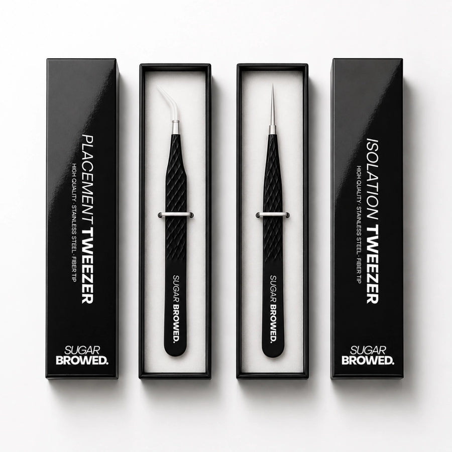 Professional brow extension tweezer set including placement tweezer and isolation tweezer.