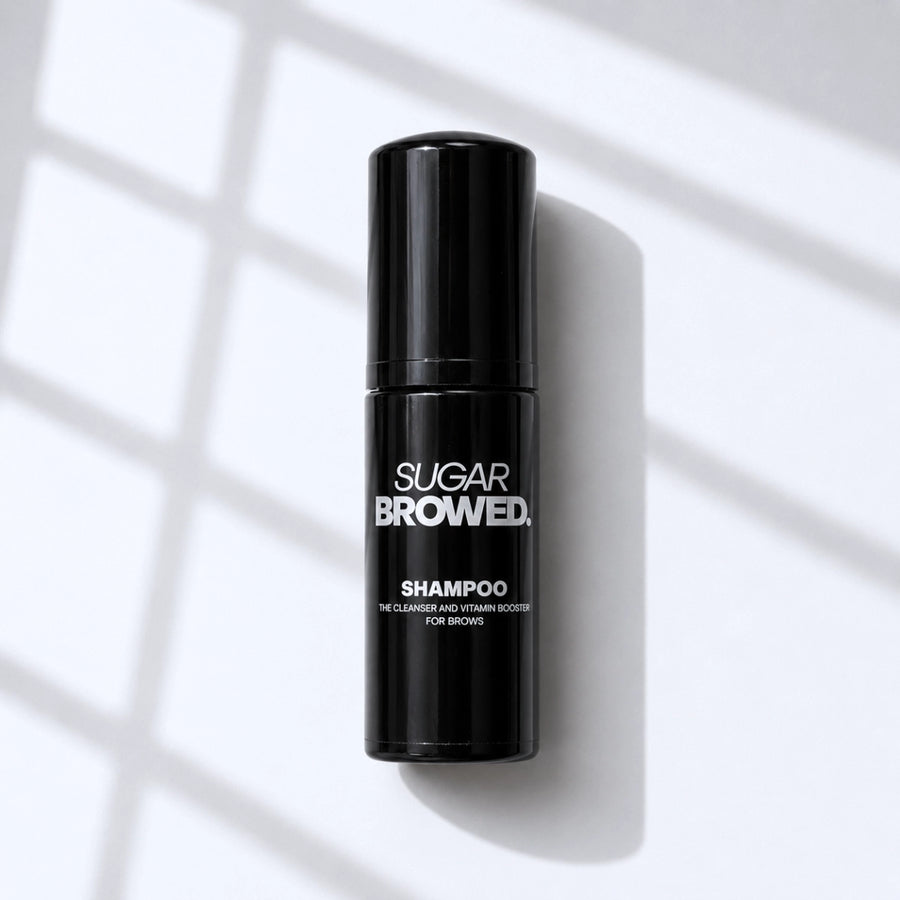 Sugar Browed Brow Shampoo held in diverse hands — gentle foaming cleanser and vitamin booster designed specifically for eyebrow care, brow extensions, and lamination treatments.