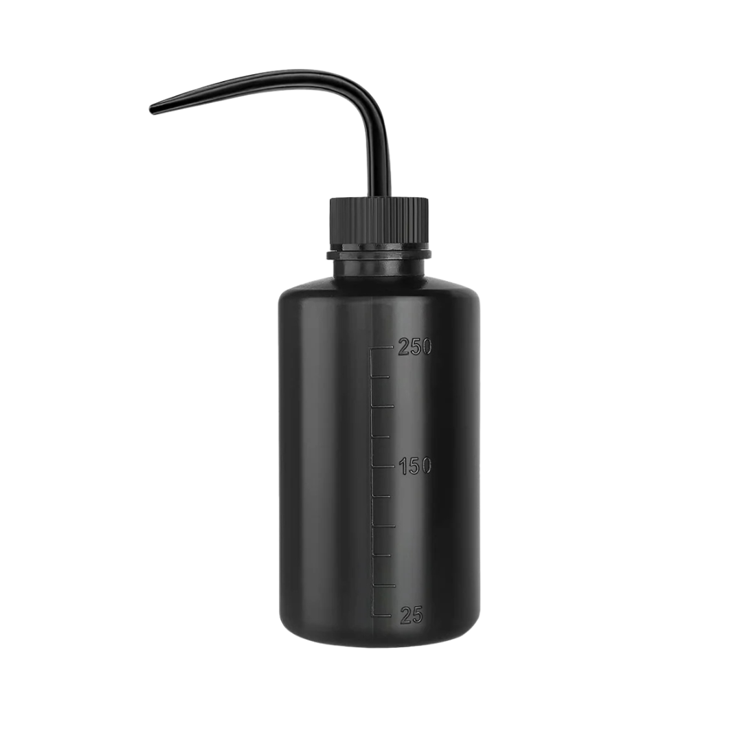 Professional water bottle with a fine nozzle for controlled rinsing during lash and brow treatments.
