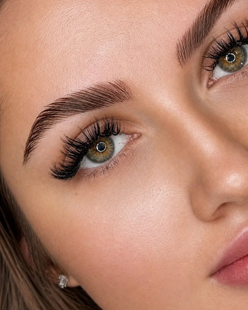 professional brow and lash lift result with defined laminated brows and lifted lashes by Sugar Browed