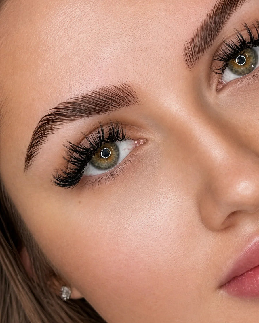 professional brow and lash lift result with defined laminated brows and lifted lashes by Sugar Browed