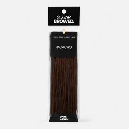 Cacao shade real human eyebrow hair extension by Sugar Browed – rich dark brown tone for bold, natural-looking brows using 100% human hair.