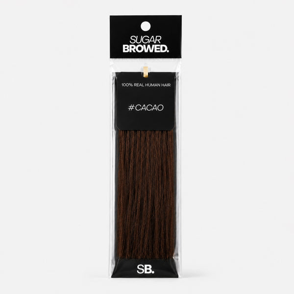 Cacao shade real human eyebrow hair extension by Sugar Browed – rich dark brown tone for bold, natural-looking brows using 100% human hair.