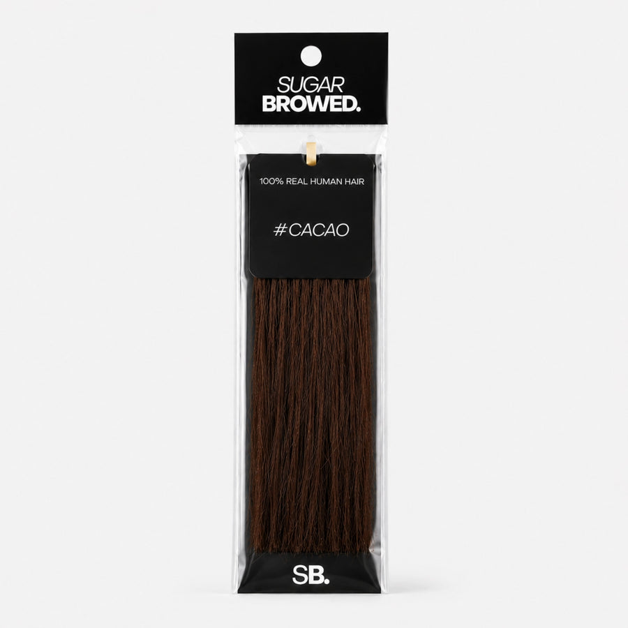 Cacao shade real human eyebrow hair extension by Sugar Browed – rich dark brown tone for bold, natural-looking brows using 100% human hair.