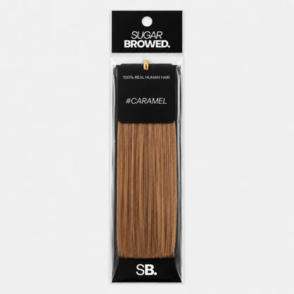 Caramel shade real human eyebrow hair extension by Sugar Browed – 100% natural hair in warm caramel tone for fuller, natural-looking brows.