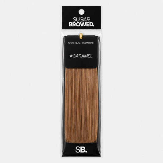Caramel shade real human eyebrow hair extension by Sugar Browed – 100% natural hair in warm caramel tone for fuller, natural-looking brows.