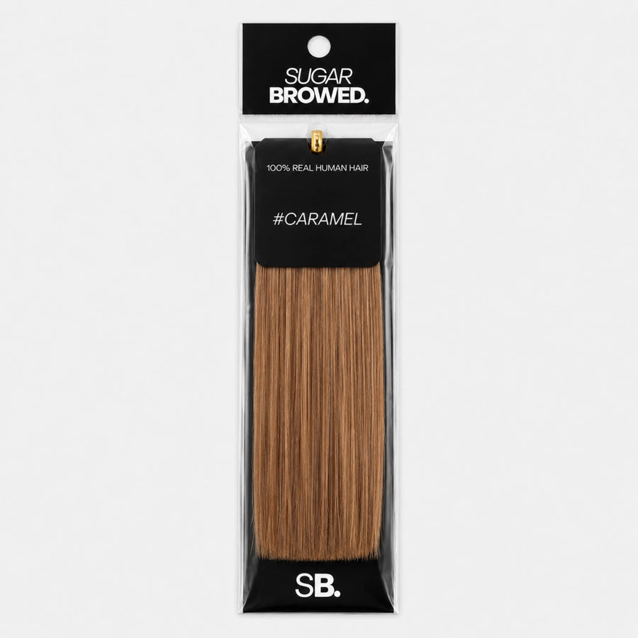 Caramel shade real human eyebrow hair extension by Sugar Browed – 100% natural hair in warm caramel tone for fuller, natural-looking brows.