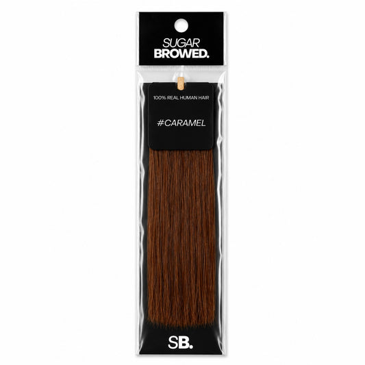 Caramel shade real human eyebrow hair extension by Sugar Browed – 100% natural hair in warm caramel tone for fuller, natural-looking brows.