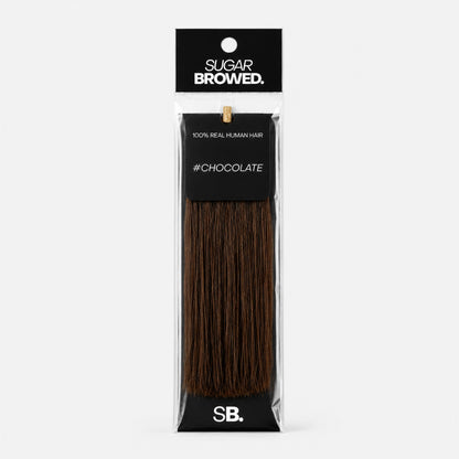 Chocolate shade real human eyebrow hair extension by Sugar Browed – warm, rich brown color made from 100% natural human hair for full and natural-looking brows.