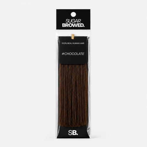 Chocolate shade real human eyebrow hair extension by Sugar Browed – warm, rich brown color made from 100% natural human hair for full and natural-looking brows.