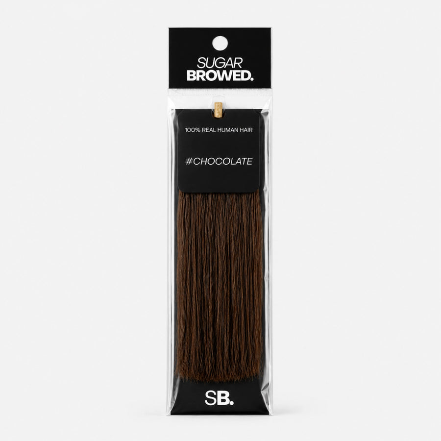 Chocolate shade real human eyebrow hair extension by Sugar Browed – warm, rich brown color made from 100% natural human hair for full and natural-looking brows.