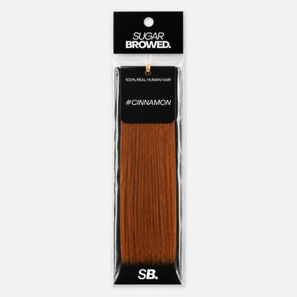 Cinnamon shade real human eyebrow hair extension by Sugar Browed – warm reddish-brown brow color made from 100% natural human hair for a soft, natural look.