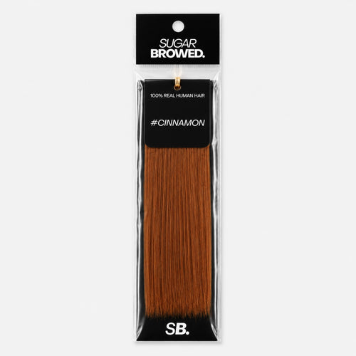 Cinnamon shade real human eyebrow hair extension by Sugar Browed – warm reddish-brown brow color made from 100% natural human hair for a soft, natural look.