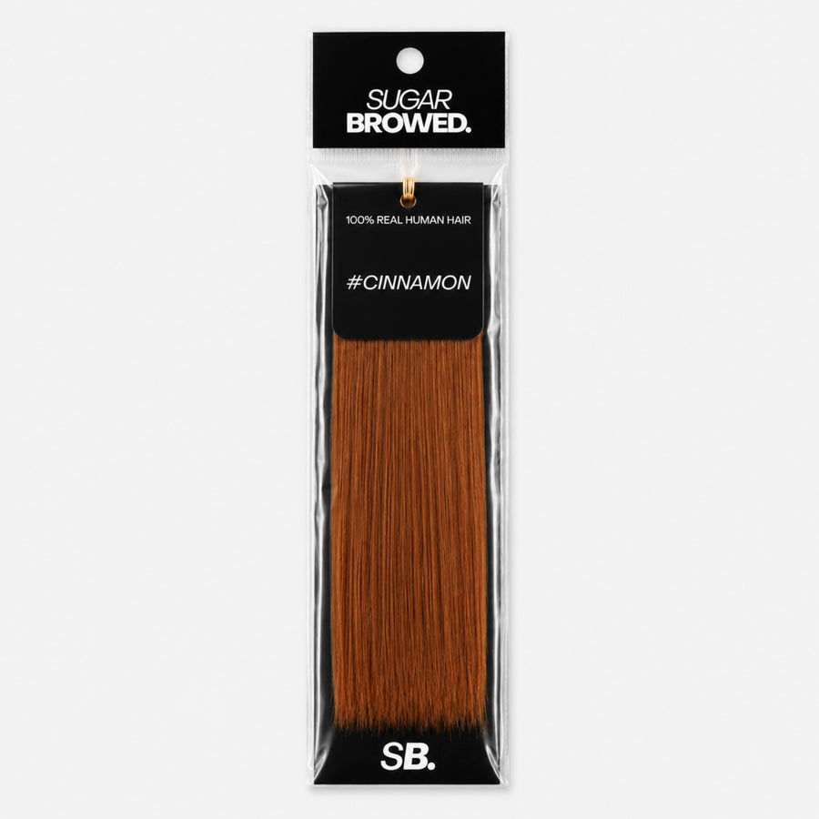 Cinnamon shade real human eyebrow hair extension by Sugar Browed – warm reddish-brown brow color made from 100% natural human hair for a soft, natural look.