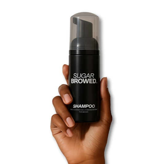 Sugar Browed Brow Shampoo held in diverse hands — gentle foaming cleanser and vitamin booster designed specifically for eyebrow care, brow extensions, and lamination treatments.