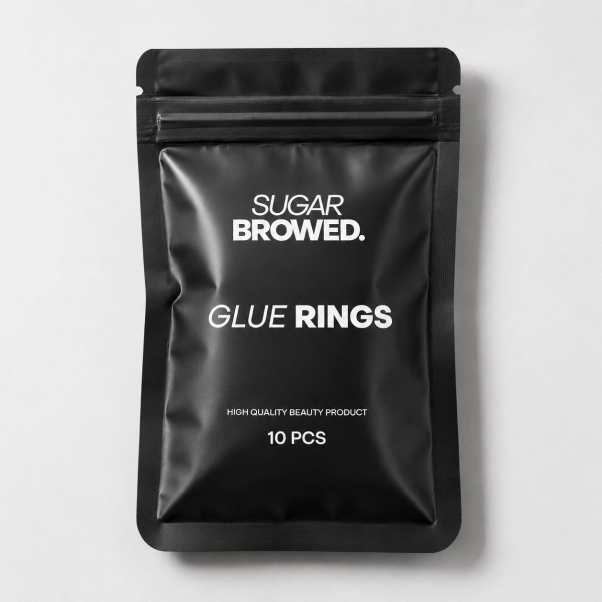 Adjustable glue rings for lash and brow artists, providing easy access to adhesive during treatments.