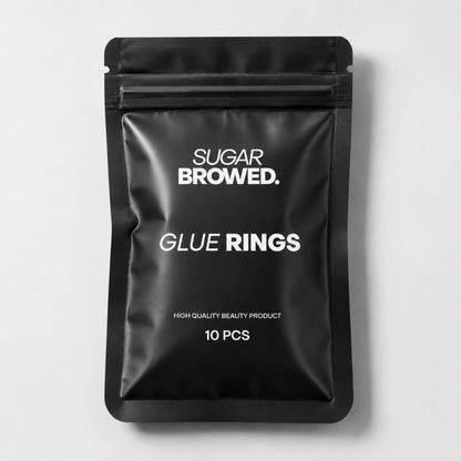 Adjustable glue rings for lash and brow artists, providing easy access to adhesive during treatments.