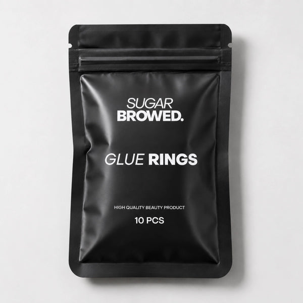 Adjustable glue rings for lash and brow artists, providing easy access to adhesive during treatments.
