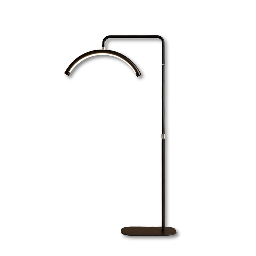 Modern black arched LED UV lamp with stand for brow extension treatments