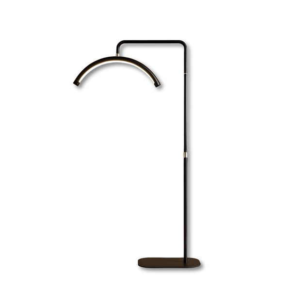 Modern black arched LED UV lamp with stand for brow extension treatments