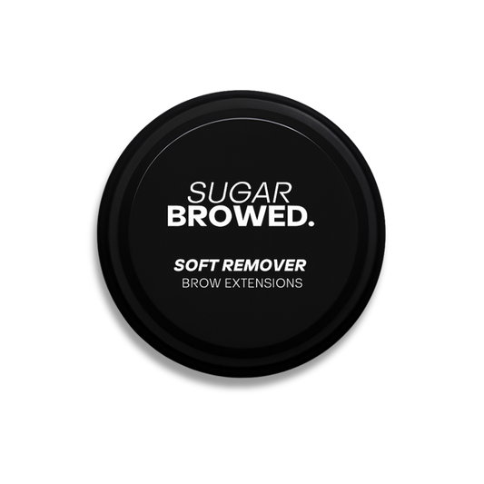 Round black jar labeled Sugar Browed Soft Remover for Brow Extensions