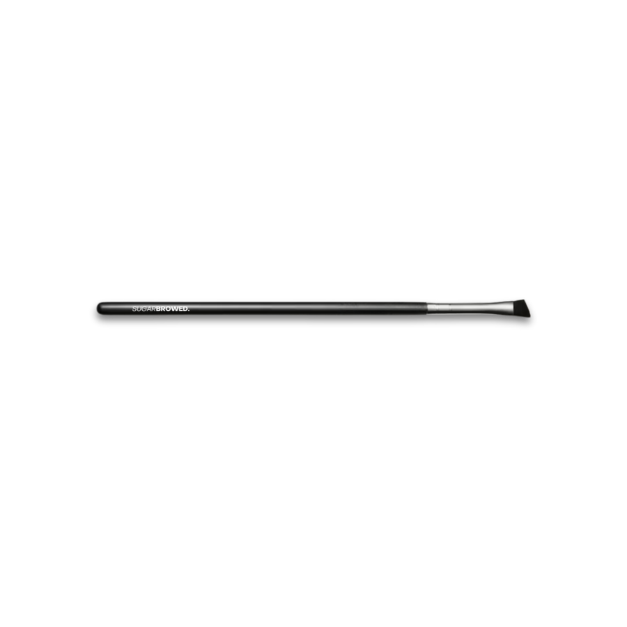 Angled tint brush with fine bristles for precise and even application during lash and brow tinting treatments.