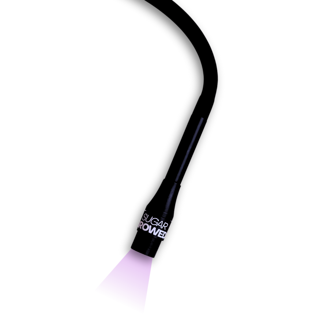 Sugar Browed UV Light Pro S7 in action with vibrant curing light — advanced tool for activating adhesive during real human hair eyebrow extension treatments. Designed for precision and fast, professional brow results.